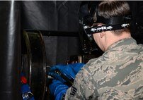 U.S. Air Force Staff Sgt. Anthony Sweat, 100th Maintenance Squadron nondestructive inspection journeyman, uses a magnetic particle unit Sept. 2, 2015, on RAF Mildenhall, England. Sweat applies electrical currents through test parts to induce magnetic fields where a special chemical bath is used to inspect for structural integrity of ferrous metals. (U.S. Air Force photo by Gina Randall/Released)