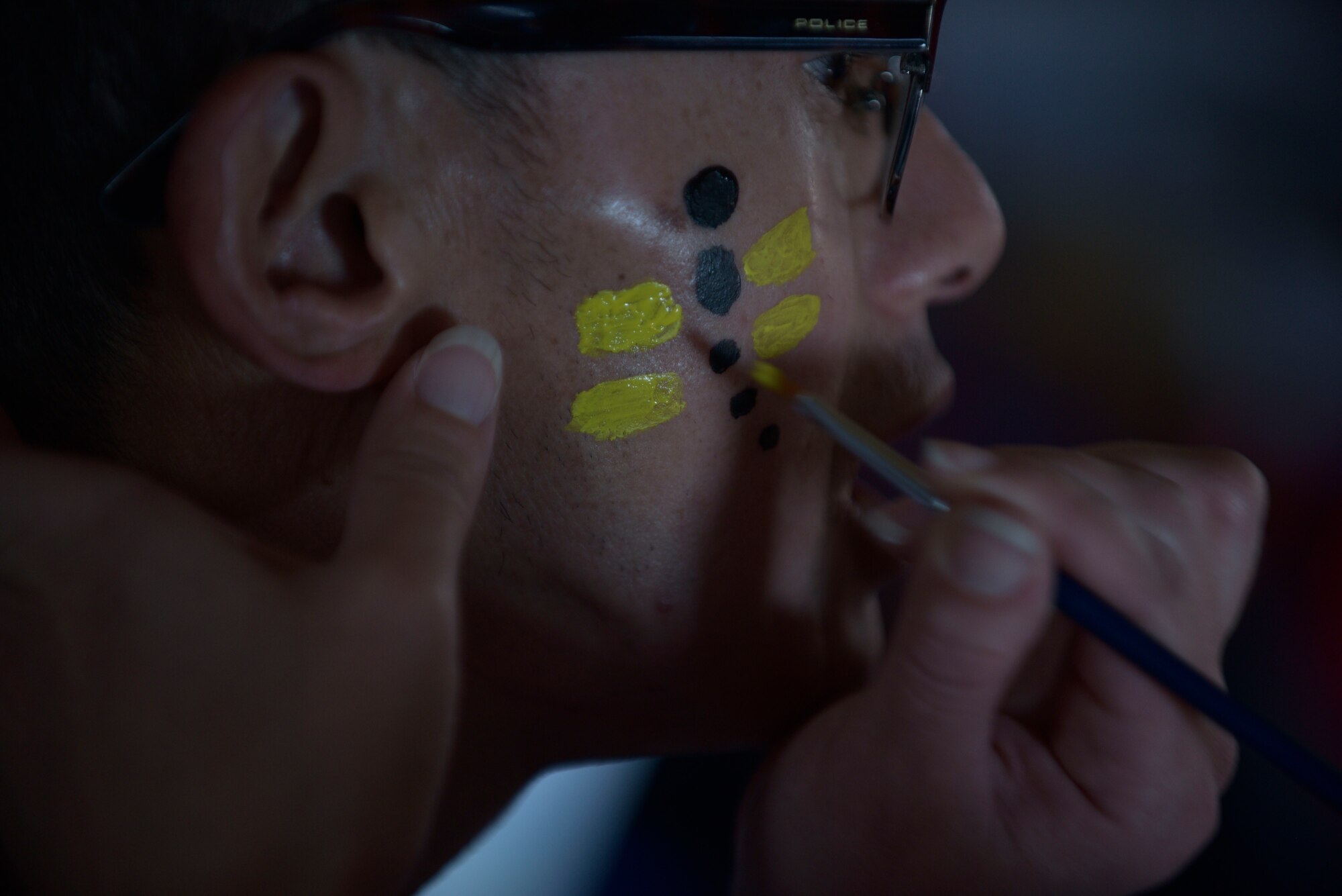 A volunteer for the 29th Annual Special Olympics paints on the face of a participant at Misawa Air Base, Japan, Oct. 10, 2015. More than 300 volunteers took part in the Olympics as chaperones, escorts and game leads. (U.S. Air Force photo by Senior Airman Jose L. Hernandez-Domitilo/Released)


