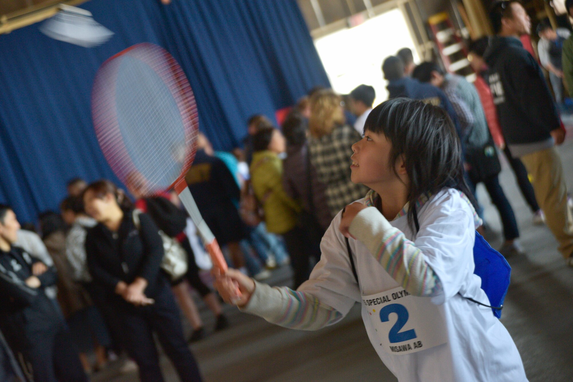 An Olympics participant plays badminton during the 29th Annual Special Olympics at Misawa Air Base, Japan, Oct. 10, 2015. Each athlete was escorted by a Misawa volunteer who also participated in the games as needed. (U.S. Air Force photo by Senior Airman Jose L. Hernandez-Domitilo/Released)