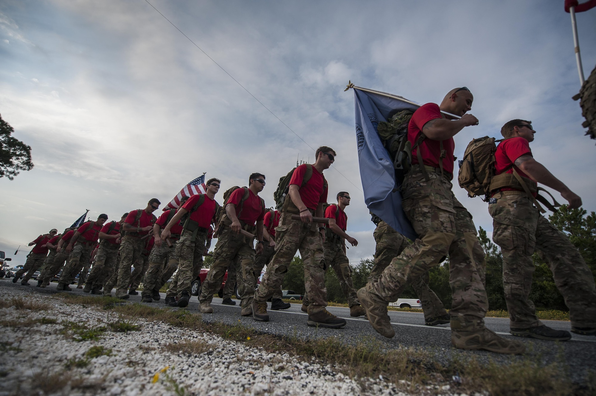 Special Tactics Airmen carry 20 batons during a memorial march to Hurlburt Field, Fla., Oct. 13, 2015. The team of 20 Special Tactics Airmen started at 2 a.m. on Oct. 4, from Joint Base San Antonio-Lackland, Texas, and marched 812 miles through five states to meet with the gold star families and end the memorial march with a ceremony on Hurlburt Field. Each two-man team walked approximately 90 miles during the 10-day trek while carrying a 50-pound ruck sack and a commemorative baton engraved with a fallen Special Tactics Airman's name. The memorial march is only held when a Special Tactics operator is killed in action that year, but honors all 19 Special Tactics pararescuemen and combat controllers who have been killed in action since 2001. (U.S. Air Force photo by Airman Kai White/Released)