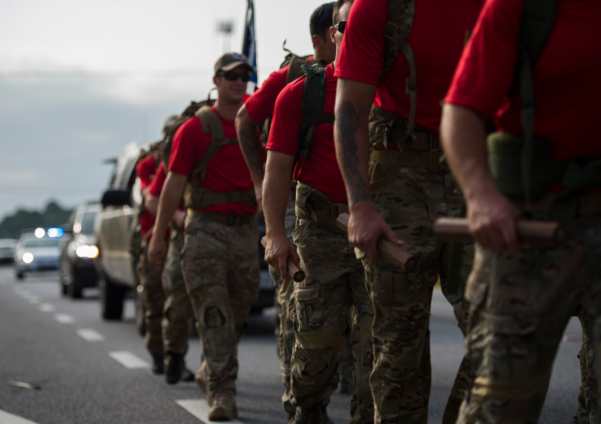 Special Tactics Airmen carry 20 batons during a memorial march to Hurlburt Field, Fla., Oct. 13, 2015. The team of 20 Special Tactics Airmen started at 2 a.m. on Oct. 4, from Joint Base San Antonio-Lackland, Texas, and marched 812 miles through five states to meet with the gold star families and end the memorial march with a ceremony on Hurlburt Field. Each two-man team walked approximately 90 miles during the 10-day trek while carrying a 50-pound ruck sack and a commemorative baton engraved with a fallen Special Tactics Airman's name. The memorial march is only held when a Special Tactics operator is killed in action that year, but honors all 19 Special Tactics pararescuemen and combat controllers who have been killed in action since 2001. (U.S. Air Force photo by Airman Kai White/Released)