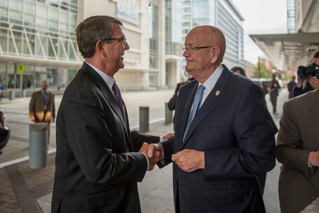 Retired Army Gen. Gordon R. Sullivan, president and chief executive officer of the Association of the U.S. Army, right, greets Defense Secretary Ash Carter as Carter arrives at the Walter E. Washington Convention Center to speak at the AUSA sustaining member luncheon in Washington D.C., Oct. 14, 2015. DoD photo by Air Force Senior Master Sgt. Adrian Cadiz