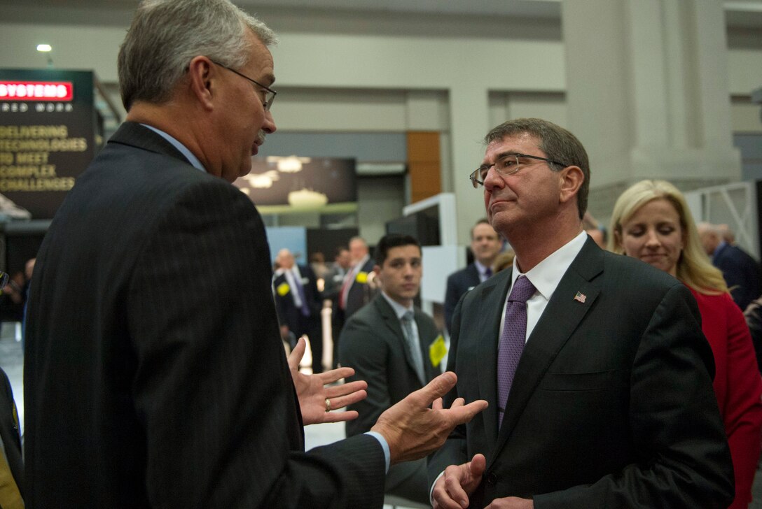 Defense Secretary Ash Carter speaks with an exhibitor at the Association of the U.S. Army conference in Washington D.C., Oct. 14, 2015. DoD photo by Air Force Senior Master Sgt. Adrian Cadiz