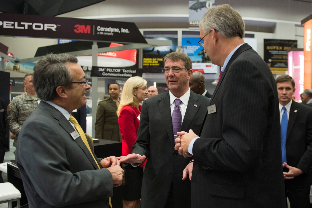 Defense Secretary Ash Carter speaks with exhibitors at the Association of the U.S. Army conference in Washington D.C., Oct. 14, 2015. DoD photo by Air Force Senior Master Sgt. Adrian Cadiz