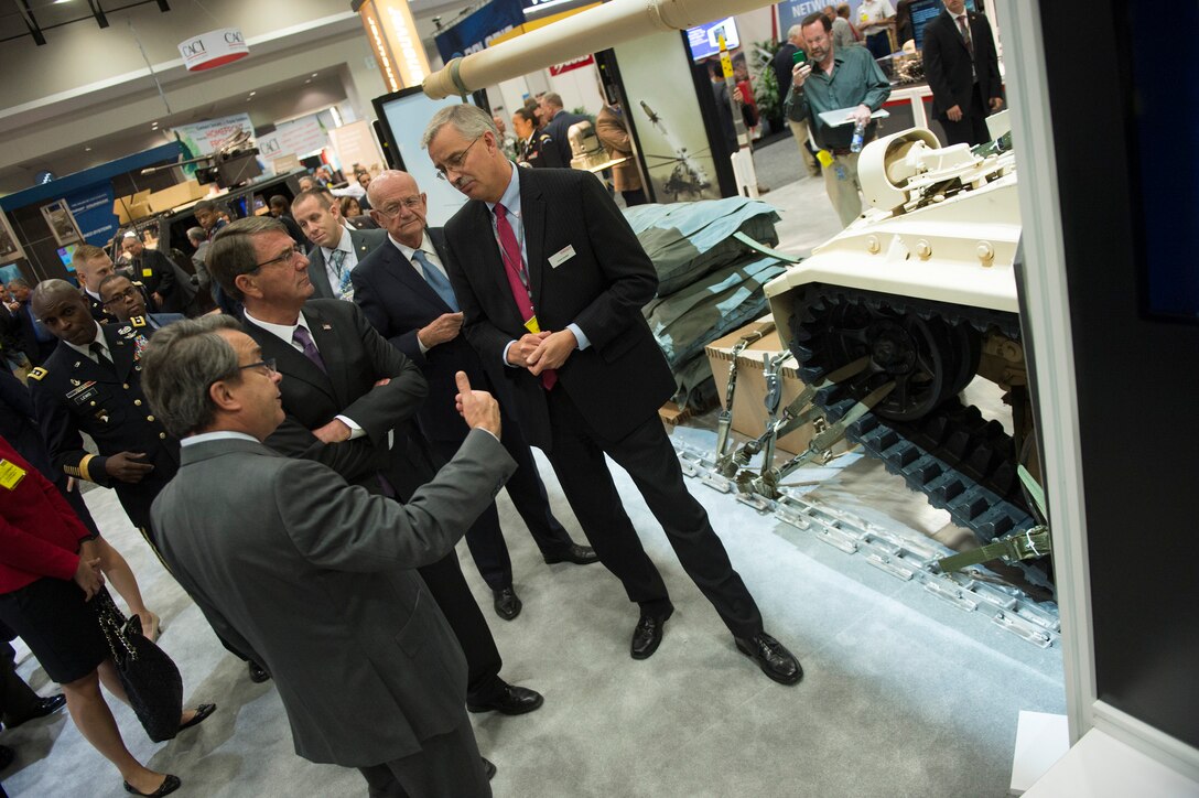 Defense Secretary Ash Carter speaks with exhibitors at the Association of the U.S. Army conference in Washington D.C., Oct. 14, 2015. DoD photo by Air Force Senior Master Sgt. Adrian Cadiz