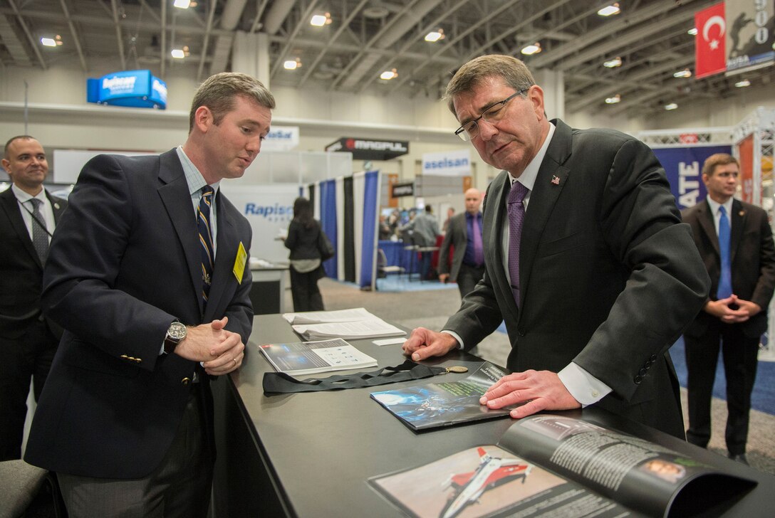 Defense Secretary Ash Carter speaks with an exhibitor at the Association of the U.S. Army conference in Washington, D.C., Oct. 14, 2015. DoD photo by Air Force Senior Master Sgt. Adrian Cadiz