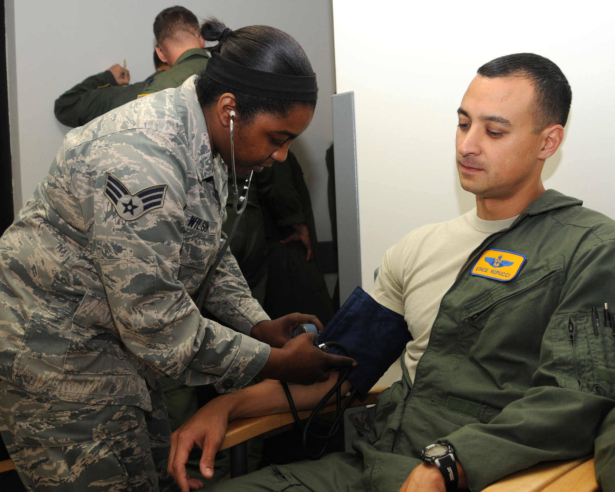 Senior Airman Cherae Wilson, a medical technician with 910th Medical Squadron, takes Maj. Vince Repucci’s blood pressure here, Oct. 3, 2014. Repucci, a navigator with the 757 Airlift Squadron, is taking his annual physical at the medical squadron. Blood pressure is one of many stations airmen go through during their physicals. (U.S. Air Force photo/Tech. Sgt. Rick Lisum)