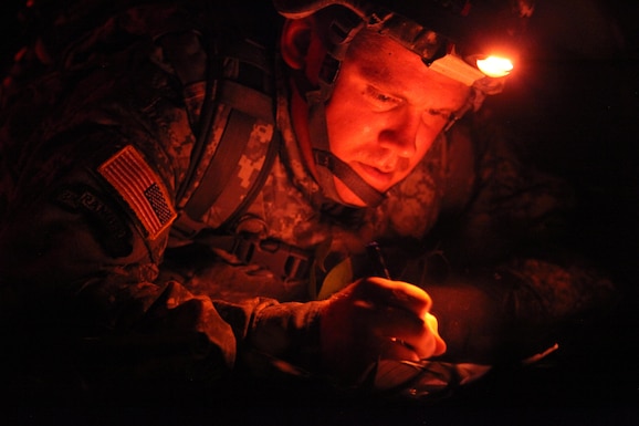 U. S. Army Staff Sgt. Andrew Fink, assigned to 409th Area Support Medical Company, U.S. Army Reserve Command, plots grid coordinates during the U.S. Army’s Best Warrior Competition at Fort A.P. Hill, Va., Oct. 5, 2015. The competition is a grueling, weeklong event that tests the skills, knowledge and professionalism of 26 warriors representing 13 commands. (U.S. Army photo by Pfc. Christopher Brecht/Released) #BestWarrior