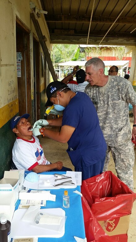 U.S. Army Col. Bruce Bikson, dentist and dental health care provider at the Ngobe Bugle MEDRETE, assisting a local Panamanian Dentist with the extraction of a tooth on a patient. Joint Task Force-Bravo conducts MEDRETEs to enhance partner nation relations through medical training with regional military forces and local civilian organizations while supporting the Panama Ministry of Health’s efforts to provide medical care to an underserviced population. (Photo by Liaison Officer, Dr. Guillermo Saenz)