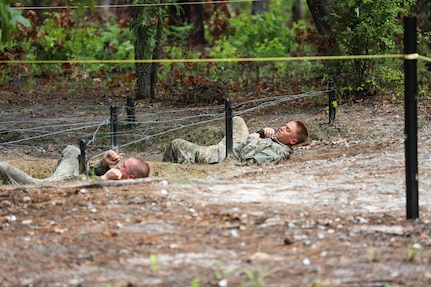 U.S. Army Soldiers participate in the Darby Queen obstacle course as part of their training at the Ranger Course on Ft. Benning Ga., June 28, 2015. Soldiers attend the Ranger Course to learn additional leadership and small unit technical and tactical skills in a physically and mentally demanding, combat simulated environment, (U.S. Army photo by Staff Sgt. Scott Brooks/ Released)               