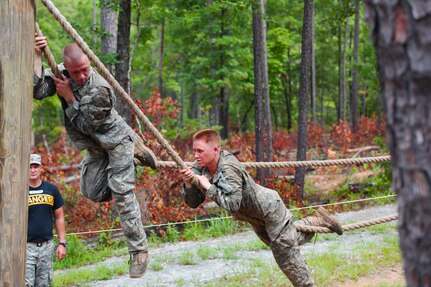 Maj. Lisa Jaster, an Army Reserve soldier, navigates through the Ranger Course on Ft. Benning, GA. 
