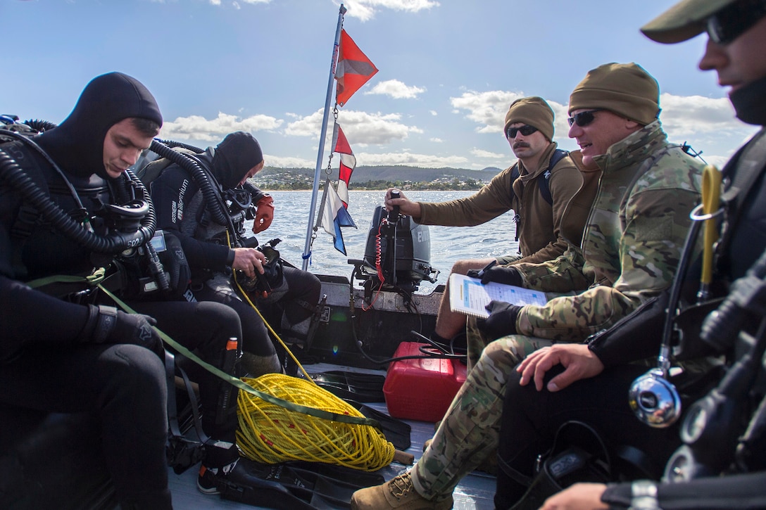 U.S. Navy sailors conduct diving operations during exercise Dugong 2015 near Hobart, Australia, Oct. 7, 2015. The sailors are assigned to Explosive Ordnance Disposal Mobile Unit 5. Dugong 2015 is a mine warfare exercise with participating units from Australia, United States, United Kingdom and Canada.  U.S. Navy photo by Petty Officer 2nd Class Daniel Rolston