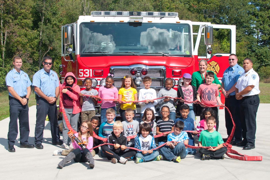 The fourth-grade class of Jessica Darrow participates in Fire Safety Week at Crossroads Elementary School Oct.7. The Quantico Fire and Emergency Services presented a fire safety program for military children throughout the week.