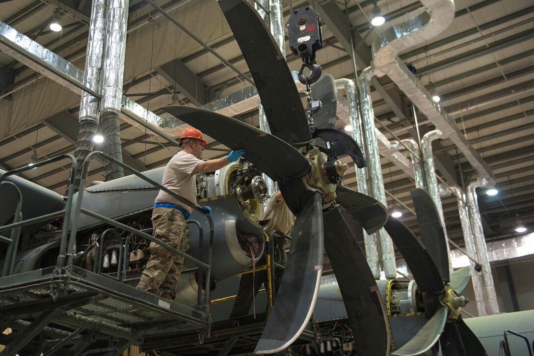 U.S. airmen change out engine blades on a C-130J Super Hercules aircraft on Bagram Airfield, Afghanistan, Oct. 1, 2015. The airmen are assigned to the 455th Expeditionary Maintenance Squadron. The C-130’s short takeoff and landing capability makes it an optimum fit for the mission in Afghanistan. U.S. Air Force photo by Tech. Sgt. Joseph Swafford