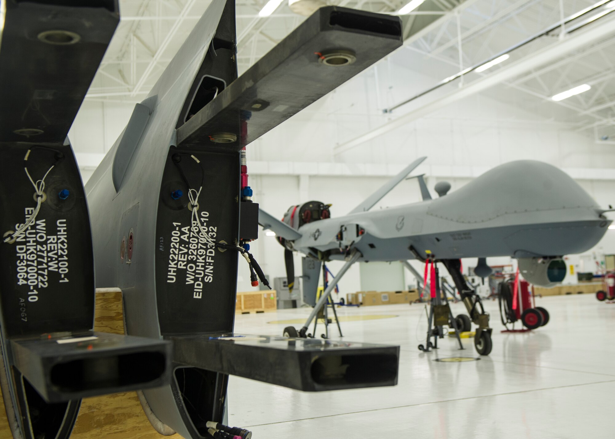 An MQ-9 Reaper sits in a hangar prior to having the wings put on at Holloman Air Force Base, Oct. 13, 2015. Putting the wings on the MQ-9 is a tedious process which involves aligning pins perfectly to ensure the wings are stabilized. The wings were replaced as part of an upgrade in the heavy weight landing gear. (U.S. Air Force photo by Airman 1st Class Emily A. Kenney/Released)