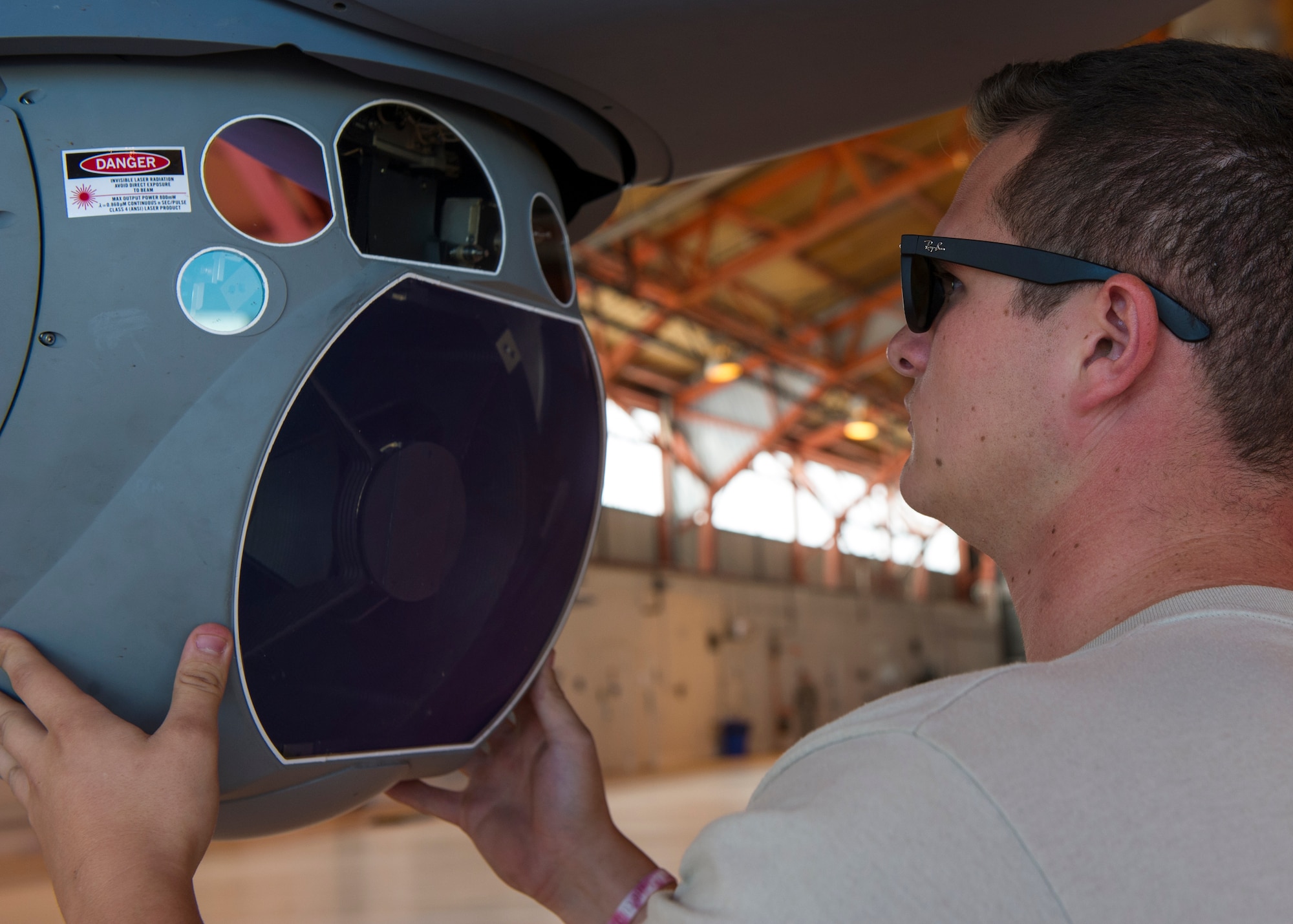 Senior Airman Daniel Hawley, an MQ-9 Reaper crew chief with the 49th Aircraft Maintenance Squadron, performs a pre-flight inspection at Holloman Air Force Base, N.M., Oct. 13, 2015. Pre-flight inspections ensure all the maintenance has been performed, and the aircraft is ready for flight. (U.S. Air Force photo by Airman 1st Class Emily A. Kenney/Released)