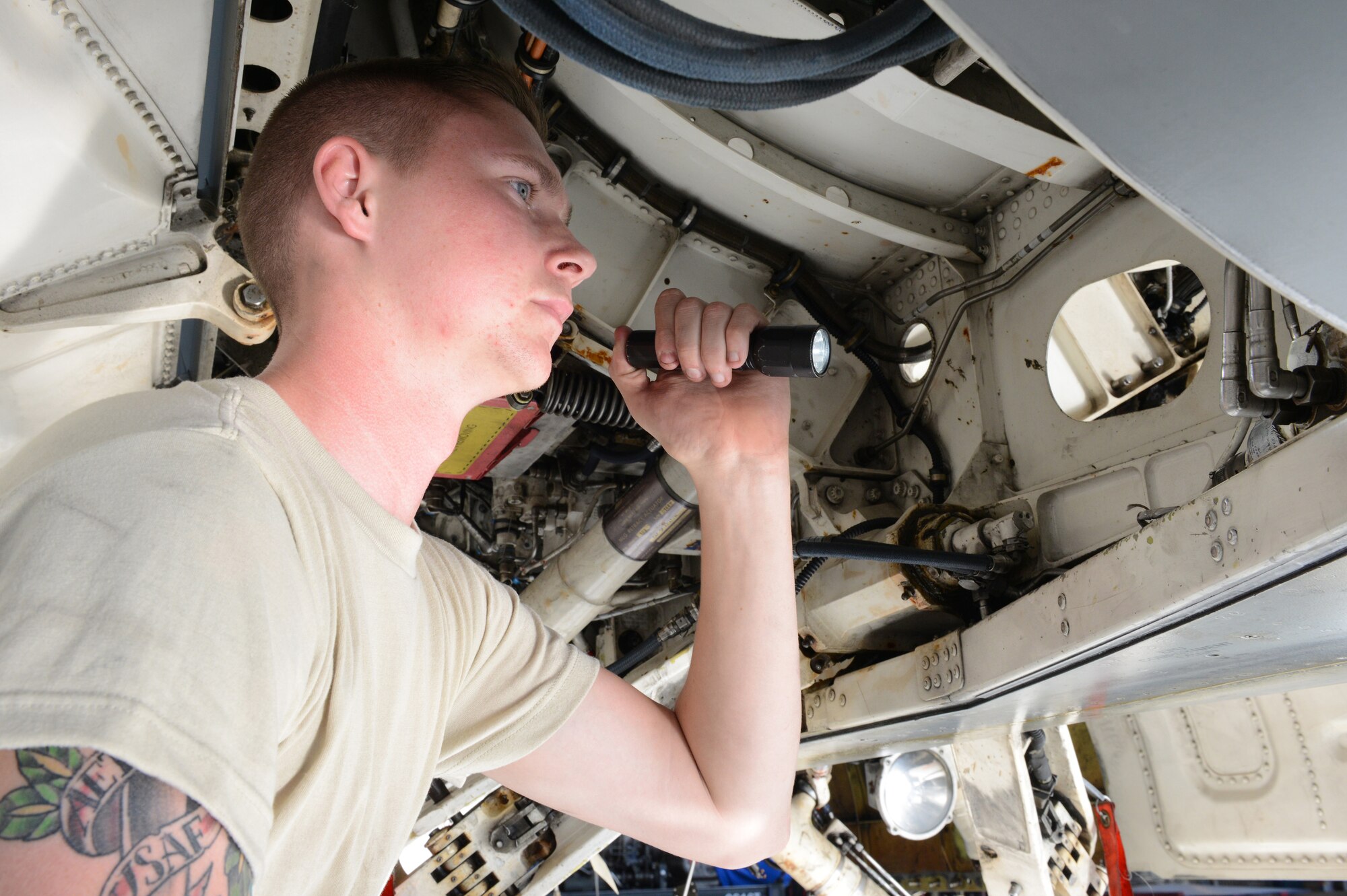 Airman 1st Class Michael Miller, 944th Fighter Wing (awaiting info), inspects hydraulic landing gear components during a phase inspection on an F-16 at Luke Air Force Base, Arizona, Oct. 9, 2015. A phase inspection occurs every 300 hours on an F-16 to get more in depth and search for any discrepancies. This continues the aircraft’s longevity. (U.S. Air Force photo by Senior Airman James Hensley)  