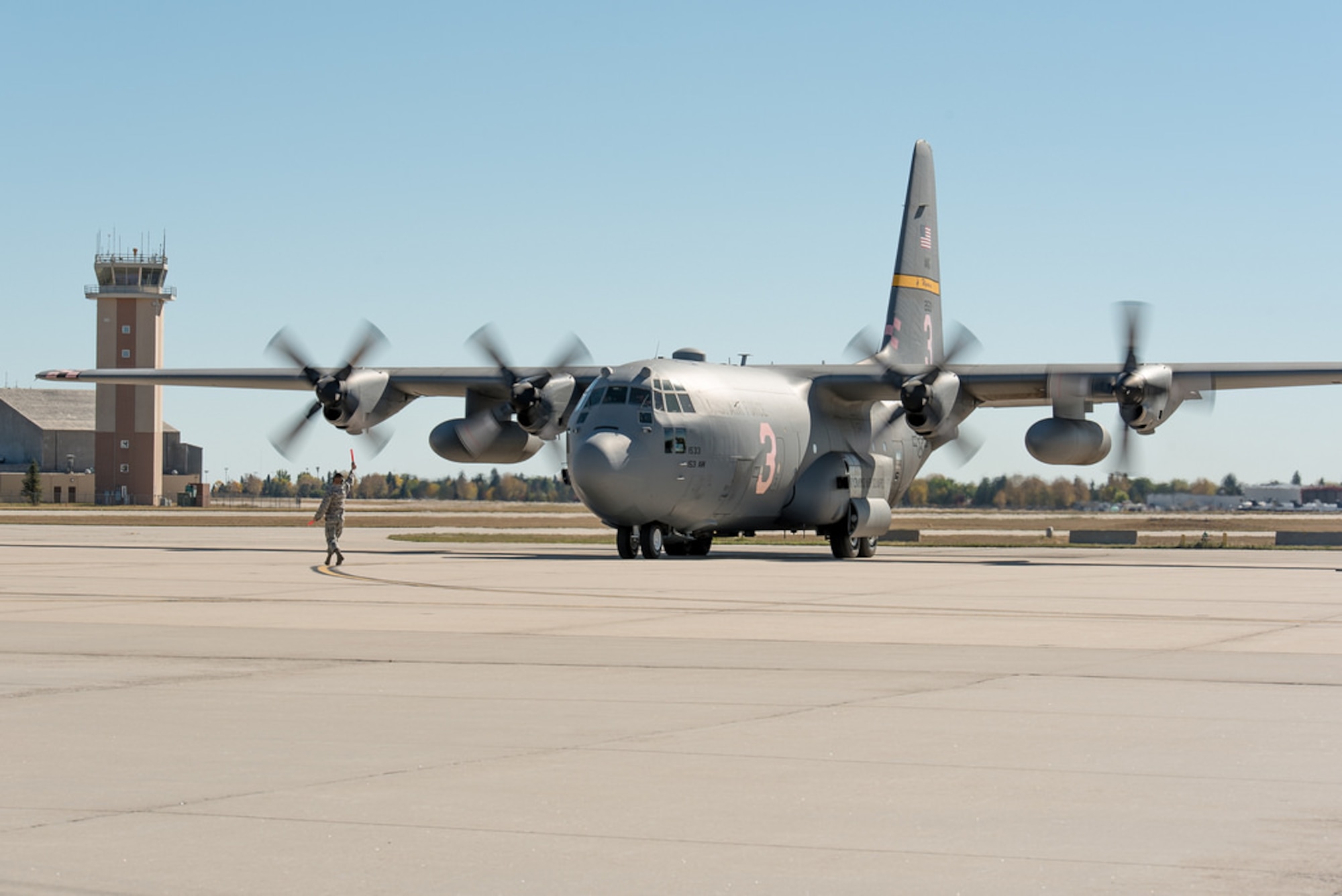A C-130H Hercules aircraft, tail number 1533, returns to Cheyenne after 14 months of repair at Hill Air Force Base, in Ogden, Utah. The aircraft landing gear was overhauled after a mechanical malfunction caused the aircrew to land with a partially extended nose landing gear after the aircraft was involved with fighting fires. (U.S. Air National Guard photo by Master Sgt. Charles Delano/released)