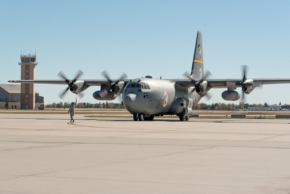 A C-130H Hercules aircraft, tail number 1533, returns to Cheyenne after 14 months of repair at Hill Air Force Base, Utah. The aircraft landing gear was overhauled after a mechanical malfunction caused the aircrew to land with a partially extended nose landing gear after the aircraft was involved with fighting fires. (U.S. Air National Guard photo/Master Sgt. Charles Delano) 