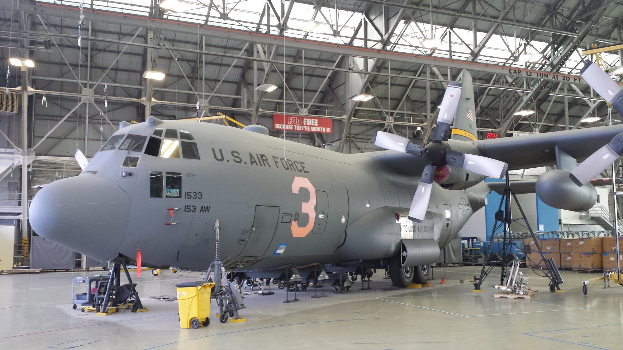 The Wyoming Air National Guard MAFFS 3 air tanker sits in hangar one at Hill Air Force Base while undergoing extensive repairs after landing without fully-extended nose gear Aug. 17, 2014. There were no injuries to the crew and damage was limited to the nose gear, structures and wiring in the lower front end of the $37 million aircraft. (Photo courtesy of Hill Air Force Base, Utah)