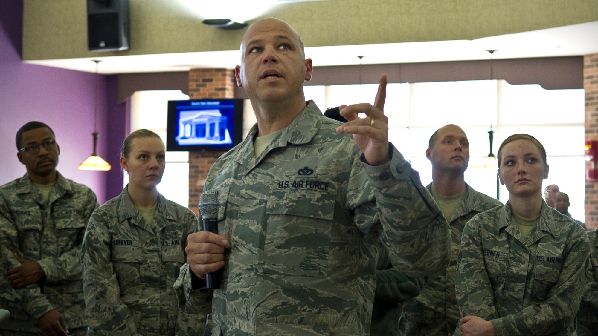 Chief Master Sgt. Rob Herman, 434th Air Refueling Wing command chief, discusses the importance of Grissom's aerial refueling mission during an enlisted call at Grissom Air Reserve Base, Ind., Oct. 4, 2015. Herman emphasized enlisted force development and the central role of developmental education. (U.S. Air Force photo/Senior Airman Katrina Heikkinen)