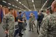 U.S. Air Force Gabrielle, center, Joint Intelligence Operations Center, Europe Analytic Center analyst, demonstrates how to properly hold a rifle during honor guard prectice at RAF Molesworth, United Kingdom, May 28, 2015. The newly-reconstructed RAF Molesworth Joint Honor Guard program consists of weekly practices, which involve learning facing movements, weapons handling and marching. (The last names of personnel have been romoved for security purposes) (U.S. Air Force photo by Staff Sgt. Ashley Hawkins/Released)