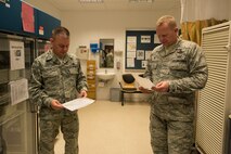 U.S. Air Force Col. Joe McFall, 52nd Fighter Wing commander, and Chief Master Sgt. Brian Gates, 52nd Fighter Wing command chief, review a medical questionnaire to receive the flu mist at the 52nd Medical Group at Spangdahlem Air Base, Germany, Oct. 7, 2015. The wing is preparing for a disease containment plan exercise to evaluate the base’s ability to respond to a public health emergency. (U.S. Air Force photo by Staff Sgt. Christopher Ruano/Released)