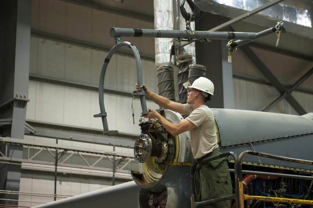A U.S. airman changes an engine out on a C-130J Super Hercules aircraft on Bagram Airfield, Afghanistan, Oct. 1, 2015. U.S. Air Force photo by Tech. Sgt. Joseph Swafford