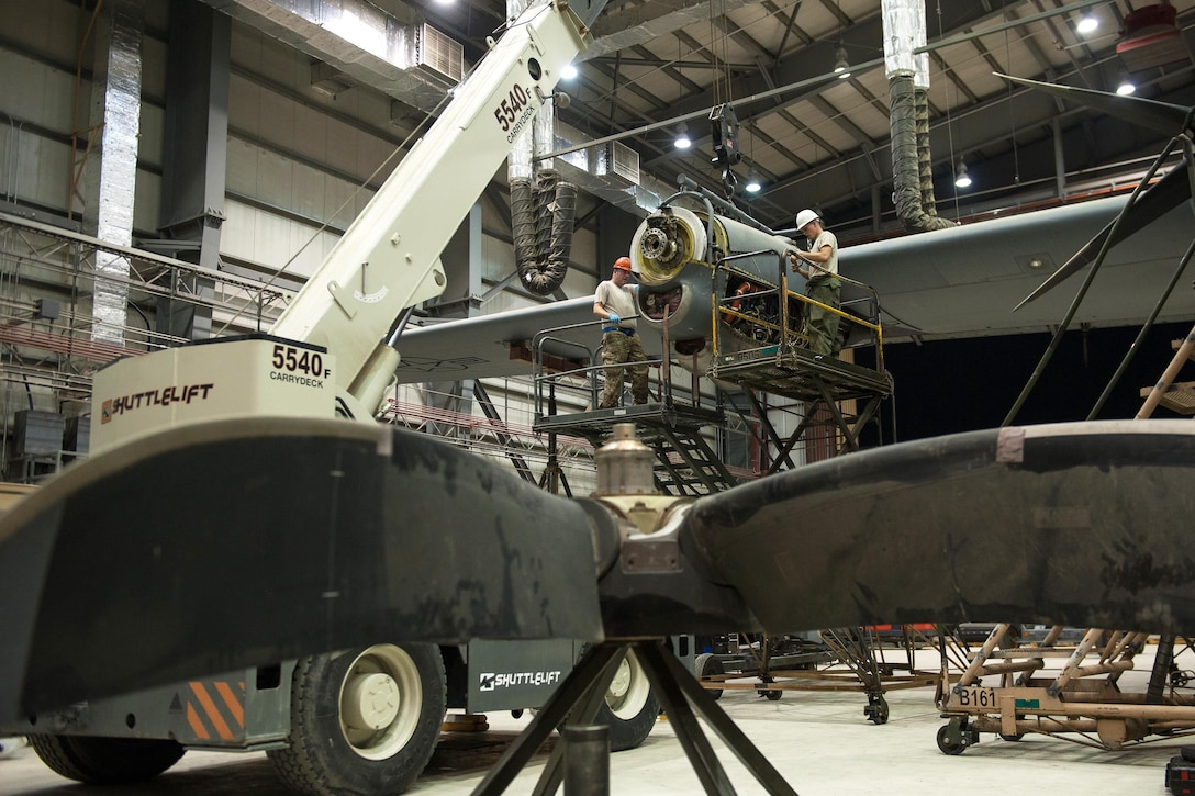 U.S. airmen change an engine out on a C-130J Super Hercules aircraft on Bagram Airfield, Afghanistan, Oct. 1, 2015. U.S. Air Force photo by Tech. Sgt. Joseph Swafford