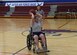 ALTUS AIR FORCE BASE, Okla. – U.S. Air Force Lt. Col. Tassika Davis, 97th Communication Squadron commander, passes a basketball during a wheelchair basketball game at the base fitness center, Oct. 14,2015. The game was held as part of National Disabled Employment Awareness Month. This year marks the 25th anniversary since the American Disabilities Act was passed by congress (U.S. Air Force photo by Airman 1st Class Kirby Turbak/Released)