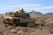 An M1A1 Main Battle Tanks with Company A, 1st Tank Battalion, 1st Marine Division, stops in order to provide fire support for British Royal Marines with 42 Commando Group during Exercise Black Alligator 2015 aboard Marine Air Ground Combat Center Twentynine Palms, Calif., Sept. 30, 2015. The exercise gave 1st Tanks an opportunity to hone and showcase their support capabilities, while building upon an already established relationship with the Royal Marines.     (U.S.Marine Corps photo by Cpl. Demetrius Morgan/RELEASED)