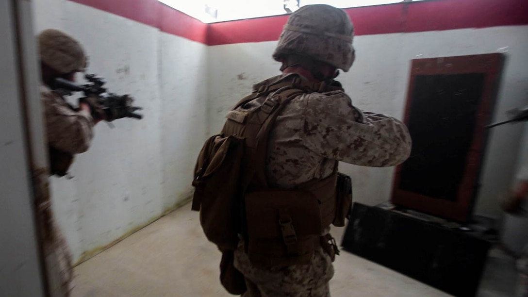 Marines assigned to the Urban Leaders Course at 1st Marine Division Schools, I Marine Expeditionary Force, clear a room during a live-fire training exercise aboard Marine Corps Base Camp Pendleton, Calif., Sept. 25, 2015. The class teaches fire team and squad leaders skills and tactics to be successful in urban environments, which they can share with the Marines they lead and the leadership of their entire unit.\