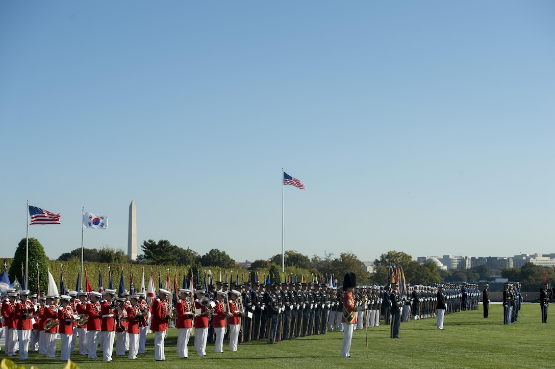 The U.S. Marine Band and service honor guard formations line the Pentagon parade field as U.S. Defense Secretary Ash Carter welcomes South Korean President Park Geun-hye to the Pentagon, Oct. 15, 2015.
