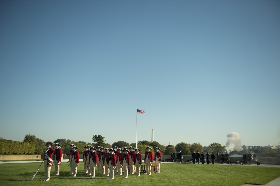 Members of the U.S. Army Old Guard Fife and Drum Corps stand at attention as the national anthem is played during a parade welcoming South Korean President Park Geun-hye to the Pentagon, Oct. 15, 2015. U.S. Defense Secretary Ash Carter met with the South Korean president to discuss matters of mutual interest. DoD photo by U.S. Air Force Senior Master Sgt. Adrian Cadiz