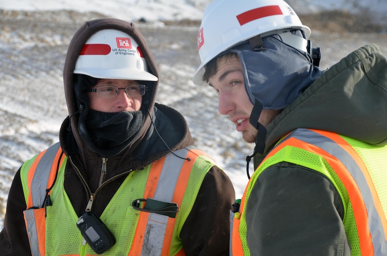 Jason Johns, left, and Brett Palmberg, both engineering and construction division, at the Tolna Coulee project, near Tolna, N.D., Jan. 18, 2012. The Tolna Coulee project is a 800-foot wide structure that will regulate the amount of water that would flow through the coulee if Stump Lake were to reach 1,458 feet above sea level.