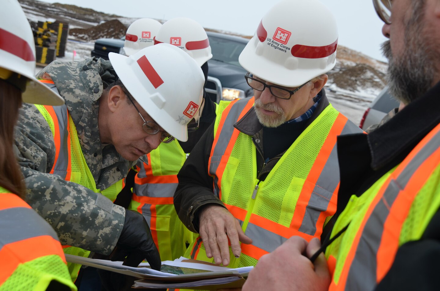 Maj. Gen. John Peabody, Mississippi Valley Division commander, left, and Bill Csajko, project management,
discuss the ongoing construction efforts at Tolna Coulee, near Tolna, N.D., during a site visit January 30, 2015. The Corps plans to complete the construction within the next six weeks.