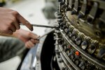 U.S. Air Force Airman 1st Class Brandon Trang, a 354th Maintenance Squadron aerospace propulsion apprentice, extracts bolts from an F110-GE-100C jet engine Oct. 8, 2015, in the Engine Shop at Eielson Air Force Base, Alaska. Trang inspected engine components for damage and wear. 