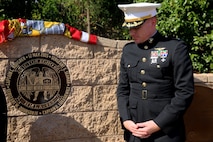 Lieutenant Col. Edward W. Powers, commanding officer of Marine Light Attack Helicopter Squadron 469, 3rd Marine Aircraft Wing, stands in front of the memorial during Park Semper Fi’s 10th anniversary ceremony at San Clemente, Calif., Oct. 11, 2015. The ceremony paid tribute to Marines with HMLA 469 who gave their lives during a humanitarian mission in Nepal, May 12, 2015.