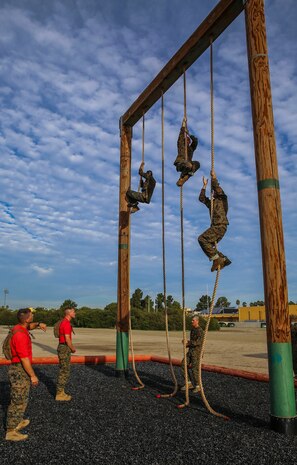 Recruits of Alpha Company, 1st Recruit Training Battalion, climb ropes during Obstacle Course II at Marine Corps Recruit Depot San Diego, Oct. 8. This was the first time the recruits got a chance to climb the ropes. They did not attempt this obstacle during Obstacle Course I and realized how much more difficult the ropes are to climb when they are fatigued from running the course. Today, all males recruited west of the Mississippi are trained at MCRD San Diego. The depot is responsible for training more than 16,000 recruits annually. Alpha Company is scheduled to graduate Dec. 18.