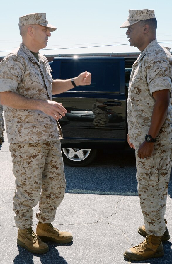 Lt. Gen. Michael G. Dana, (left) deputy commandant, Marine Corps Installations and Logistics, talks with Maj. Gen. Craig C. Crenshaw, commanding general, Marine Corps Logistics Command, before a tour of the Distribution Management Center to gain insight on the facilities processes during his visit to Marine Corps Logistics Base Albany, Oct. 14. 