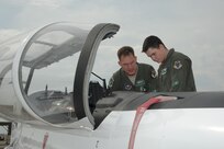 Lt. Col. John Bremer (left), 560th Flying Training Squadron chief of scheduling, shows Zachary Reynolds a T-6 aircraft during his “Pilot For a Day” tour Oct. 7 at Joint Base San Antonio-Randolph. The "Pilot For a Day" program allows children of all ages who have a serious or chronic health condition to be guests of the 12th Flying Training Wing and its flying squadrons for an entire day. In doing so, members of the 12th FTW strive to give each child a special day and a respite from challenges they may face.
Photo by Joel Martinez
