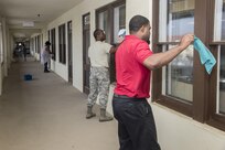 Air Education and Training Command employees clean windows at the AETC headquarters building during Joint Base San Antonio Proud Week Oct. 7, 2015, at JBSA-Randolph. Proud Week gives JBSA members an opportunity to pause from daily operations and focus on maintaining a high beautification standard throughout JBSA.