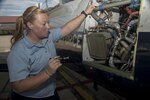 Nicole Goss, 12th Flying Training Wing Maintenance Directorate crew chief, inspects a T-6 Texan II prior to take off Sept. 24 at Joint Base San Antonio-Randolph. 
