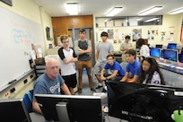 Members of the Randolph Independent School District, CyberPatriot team, discuss upcoming competition tactics during their weekly meeting Sept. 28, 2015 at Joint Base San Antonio-Randolph High School. In each of the three competition round, the team is given a virtual machine that contains several vulnerabilities and the team with the most fixes passes onto the next round, with hopes of making it to the National Championships in Washington, D.C.  CyberPatiot's goal is to excite students about Science, Technology, Engineering, and Mathematics (STEM) while giving them hands on exposure to the foundations of cyber security.