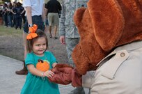 Willow Price meets McGruff the Crime Dog during the National Night Out Oct. 6 at Joint Base San Antonio-Randolph. Hosted in a block party atmosphere, National Night Out provides an opportunity each year for JBSA-Randolph community members to interact with each other and first responders and to learn about various base agencies.