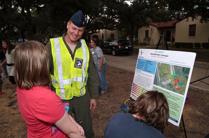 Maj. Jason Powell, 12th Flying Training Wing safety office wildlife aircraft strike hazard program manager, describes how his unit works to lessen the risk of bird strikes for the 12th FTW flying missions during National Night Out Oct. 6 at Joint Base San Antonio-Randolph. This mission was one of many featured during National Night Out to introduce JBSA-Randolph community members to different base agencies.