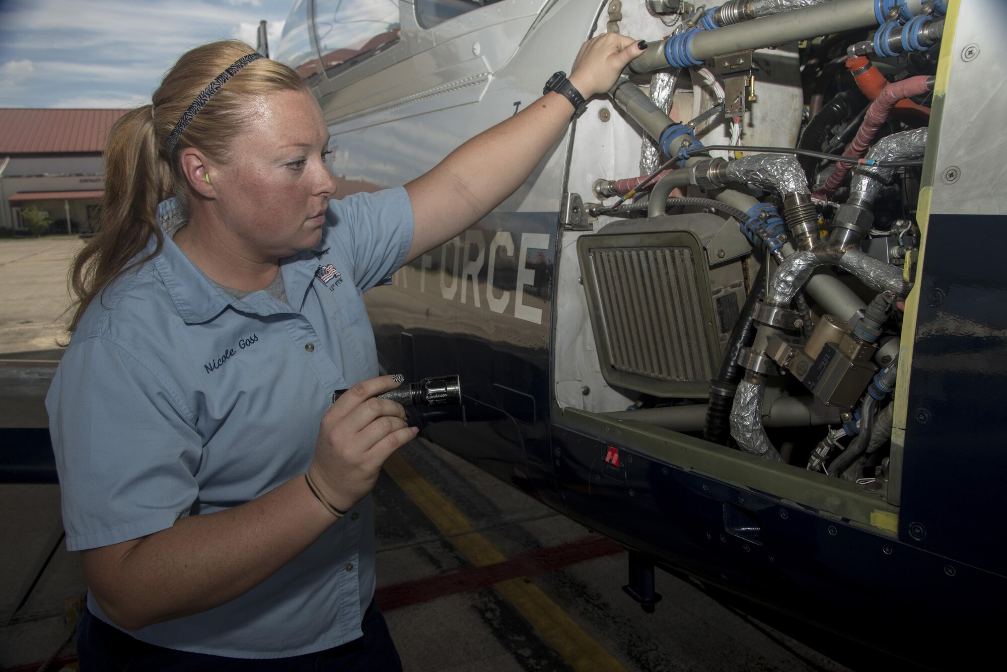 Nicole Goss, 12th Flying Training Wing Maintenance Directorate crew chief, inspects a T-6 Texan II prior to take off Sept. 24 at Joint Base San Antonio-Randolph. 