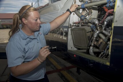 Nicole Goss, 12th Flying Training Wing Maintenance Directorate crew chief, inspects a T-6 Texan II prior to take off Sept. 24 at Joint Base San Antonio-Randolph. 