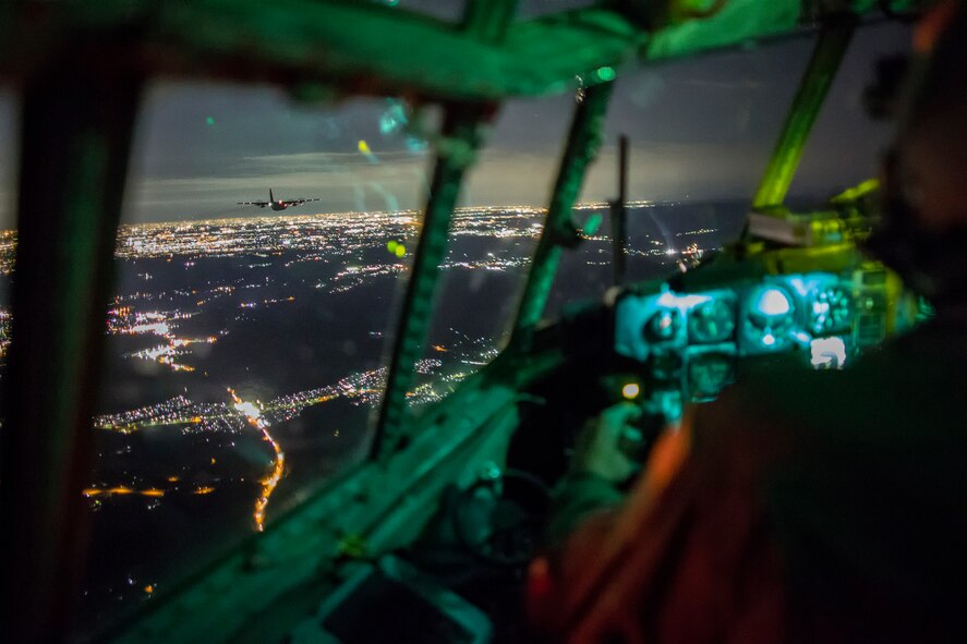 Capt. Thomas Bernard, 36th Airlift Squadron C-130 Hercules pilot, executes two-ship formation flight over the Kanto Plain during a training mission, Oct. 14, 2015. The training mission ensured that the airlifters are ready to respond to a variety of contingencies throughout the Indo-Asia Pacific region.  (U.S. Air Force photo by Osakabe Yasuo/Released)