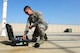 Tech. Sgt. Brett Larson, 134th Expeditionary Fighter Squadron F-16 Fighting Falcon crew chief, Vermont Air National Guard, retrieves a tool from his toolbox at Kunsan Air Base, Republic of Korea, Oct. 6, 2015. The 134th EFS was redeployed from Kadena Air Base, Japan to Kunsan AB as part of a theater security package. In an effort to underscore the U.S. commitment to regional security and stability, the 134th Expeditionary Fighter Squadron deployed to Kunsan as part of a rotational theater security package. (U.S. Air Force photo by Staff Sgt. Nick Wilson/Released) 